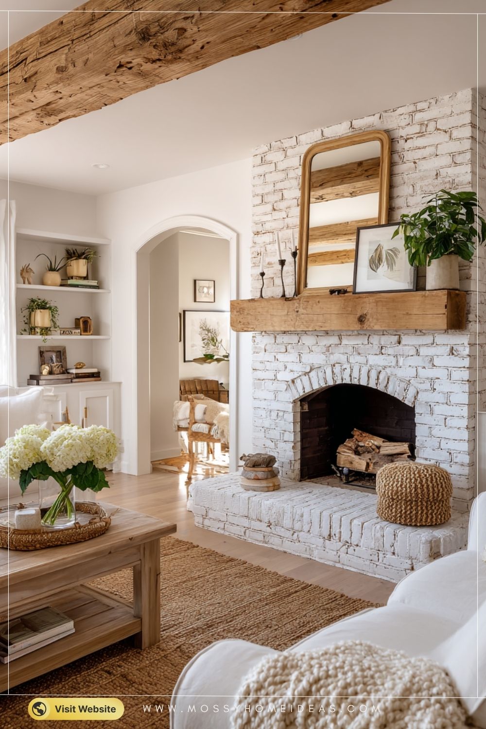 Whitewashed Brick Fireplace with Rustic Beam Mantel in Cozy Farmhouse